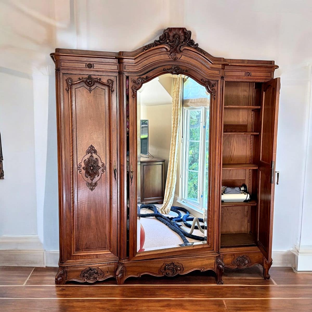 French Louis XV Style Three-Door Carved Walnut Armoire with Mirrored Center Door, c. 1870–1900